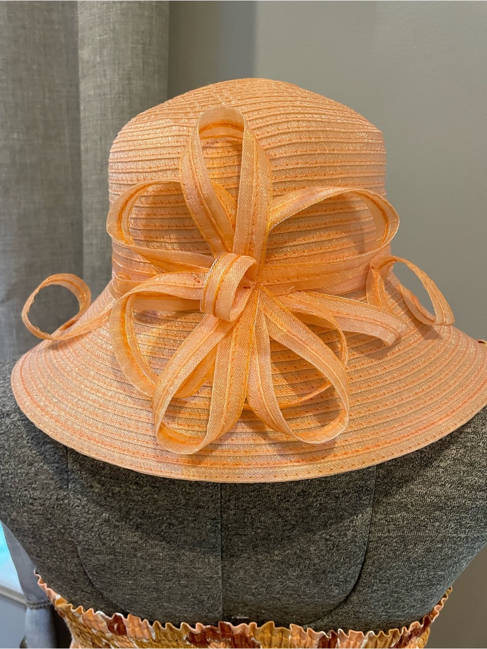 Peach wide-brim dress hat designed by the milliner brand Giovannio New York